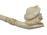 a picture of a carved pipe with a man ' s head on it
