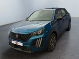vue de face d'un SUV bleu garé dans une grande pièce