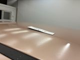 a remote control sitting on a counter in a kitchen