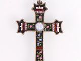 a close up of a cross on a white background