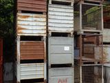 many crates stacked on top of each other in a garage
