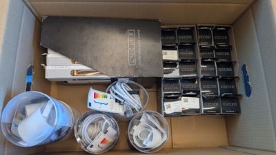 a cardboard box with a bunch of electronics inside of it