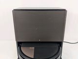 a close up of a laptop computer sitting on top of a stand