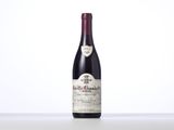 a close up of a bottle of wine on a table