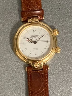 a close up of a wrist watch on a table