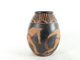a vase that has a picture of a man on it