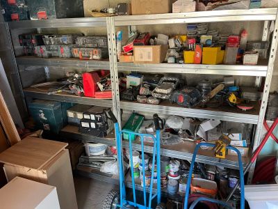 a blue cart that is sitting in a garage
