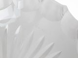 a large white vase with a decorative design on it