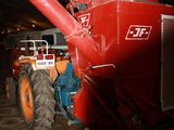 a red combiner that is parked inside of a building