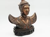 a close up of a statue of a woman wearing a hat
