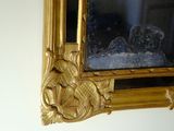 a mirror hanging on the wall in a room