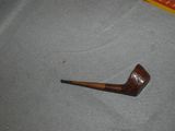 a pipe that is sitting on the floor next to a bag