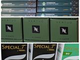 several boxes of coffee are stacked on top of each other in a store