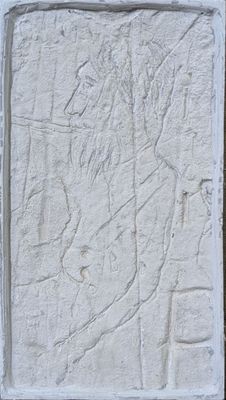 relief of a man on a horse on a stone block