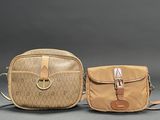 pair of vintage coach purses with monogramming and leather handles