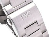 a close up of a watch on a white surface with a white background