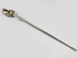 an old sword with a metal handle on a white surface