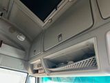 a view of the inside of a vehicle with a flat screen tv