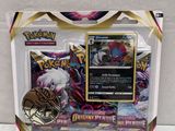 a close up of a box of pokemon cards on a white surface