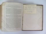 a book with a piece of paper on top of it