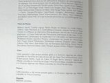 someone is holding a book open to a page with a picture on it