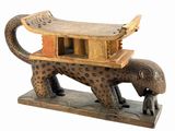 statue of a leopard with a house on its back