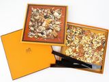 a box with a piece of pizza in it and a knife in it