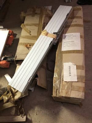 a pile of boxes and a metal object on the floor