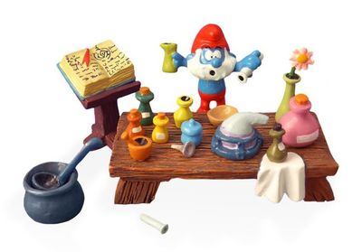 toy figurines of a table with a book, a potted plant, a book, a spoon, and a book