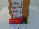 several boxes and a piece of paper sitting on top of a table