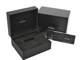 a black box with a watch inside of it on a white background