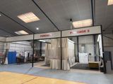 a photo of a large warehouse with a lot of windows