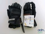 a pair of gloves and a knife on a table