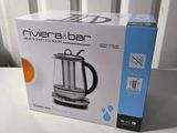 the box is open on the table next to the coffee maker