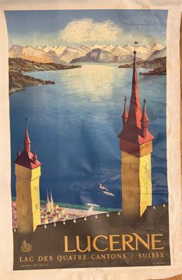 a large poster of two towers on the side of the water