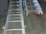 two ladders that are attached to the side of a building