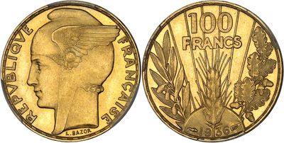 a close up of a gold coin with a woman ' s head on it