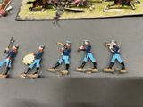 a lot of toy soldiers that are on a table