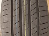 a close up of a car tire with a yellow line on it
