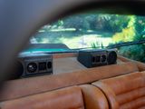 a reflection of a car in a rear view mirror