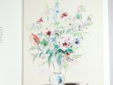 a drawing of a vase of flowers in a book