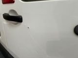 a white van with a black handle on the side of it