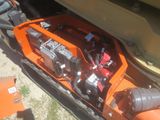 a small engine in the back of a truck