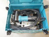 a blue tool box with tools in it on the floor