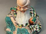 a figurine of a man with a beard and a hat