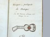 un livre ouvert sur lequel est dessiné une guitare