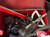 a red tool box with tools in it on the floor