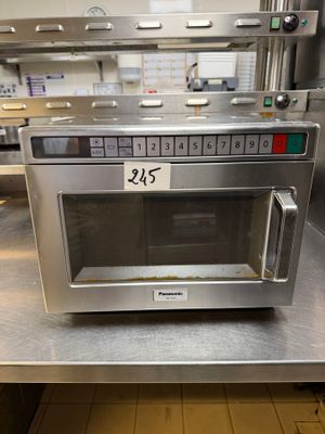 a microwave that is sitting on a counter in a kitchen