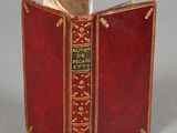 a red book that is open on a table