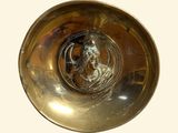 a metal bowl with a picture of a horse in it